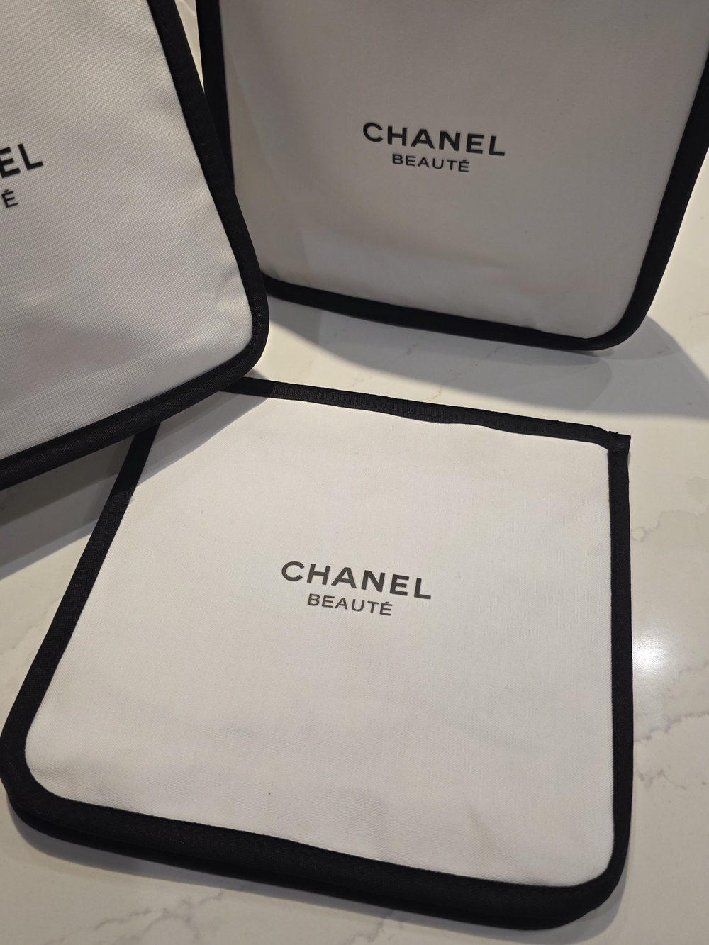 CHANEL Beauté White and Black Cosmetic Pouch